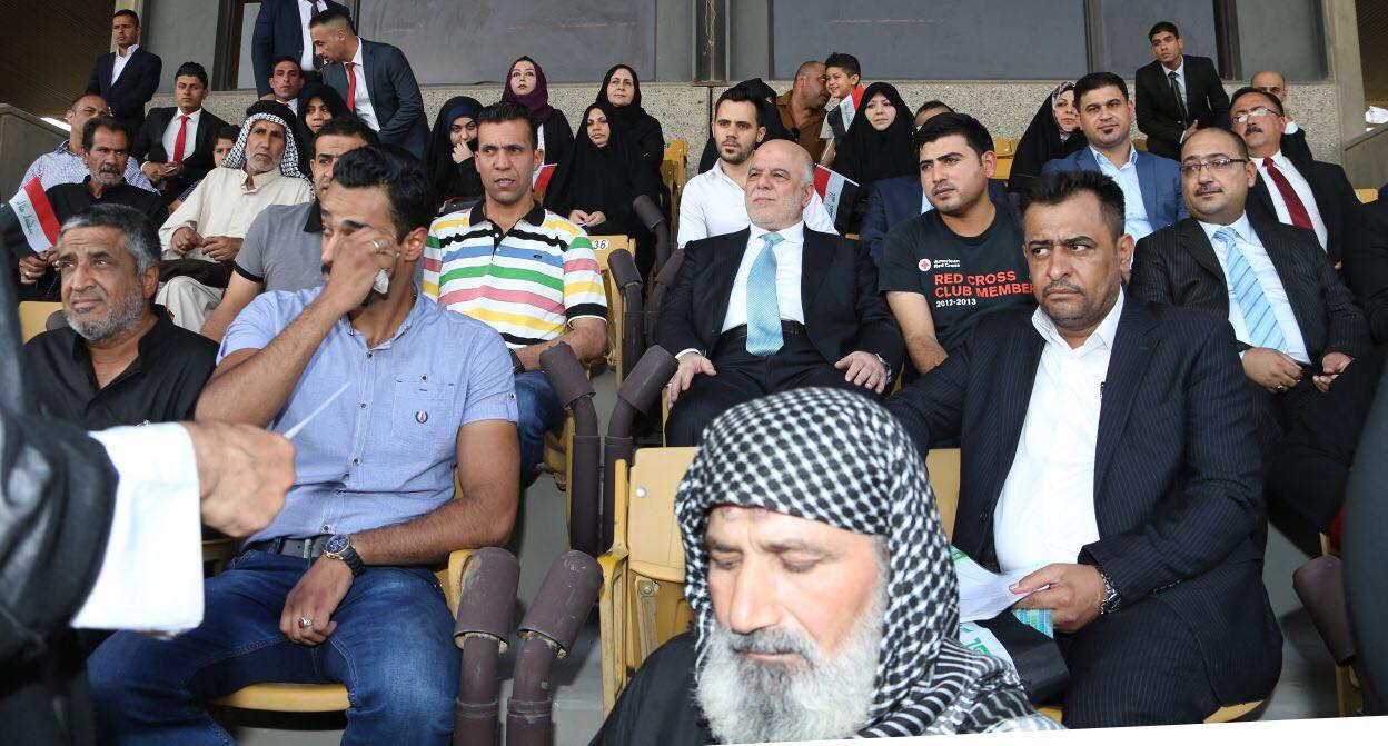 Iraqi Prime Minister Haider al-Abadi with the families of the fallen Iraqi soldiers during the military parade in Baghdad, July 15, 2017. (Photo: Iraqi Prime Minister’s Press Office)